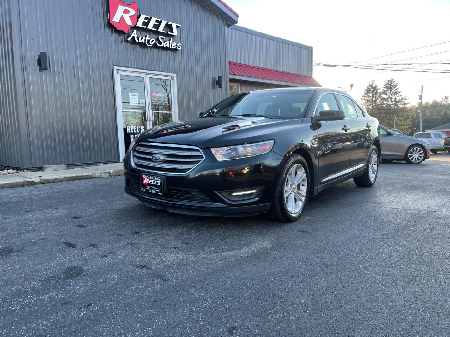 2013 Black /Black Ford Taurus SEL FWD (1FAHP2E85DG) with an 3.5L V6 DOHC 24V engine, 6-Speed Automatic transmission, located at 547 E. Main St., Orwell, OH, 44076, (440) 437-5893, 41.535435, -80.847855 - Photo#0